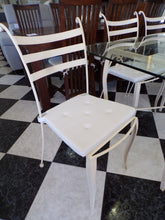 Load image into Gallery viewer, 1022 - Cream iron table (90cm x 160cm) with glass top and 8 chairs + cushions in very good condition!
