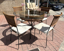 Load image into Gallery viewer, 1056 - Round glass/rattan table (110cm across) + 4 chairs + cushions in good condition!

