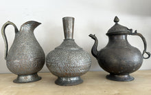 Cargar imagen en el visor de la galería, 1110 -  Left: Antique India Brass Handmade Engraved Jug(30cm high) 85€ Middle: Antique Islamic Indo-Persian tin-plated copper vase, 19th century 85€. Right; Antique Islamic Jug 85€

