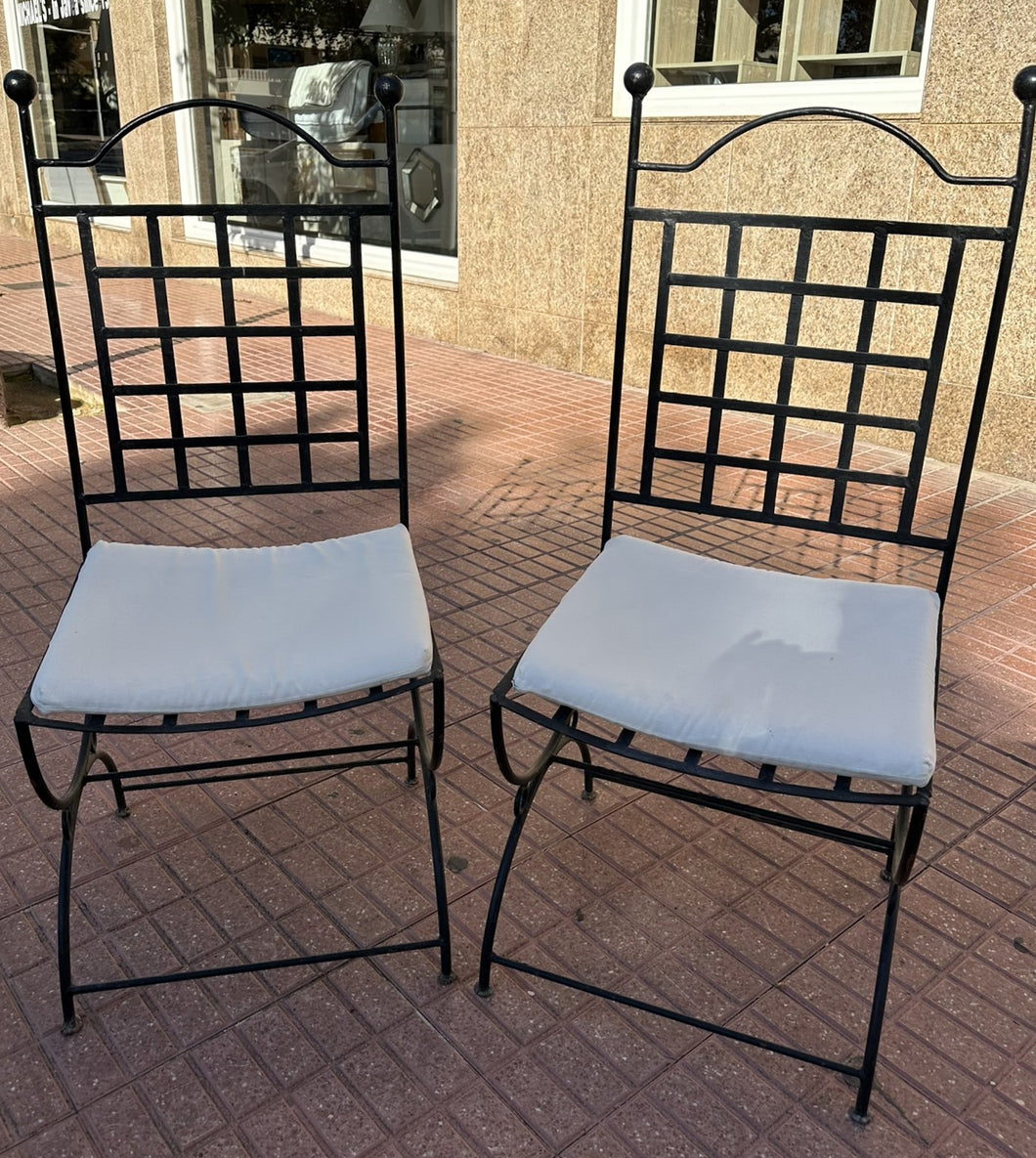 1101 - Heavy wrought iron chairs with cushions. 120€ for both!