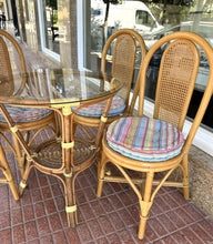 Load image into Gallery viewer, 1028 - Round bamboo glass table (90cm) + 4 chairs + cushions. 225€ for the set

