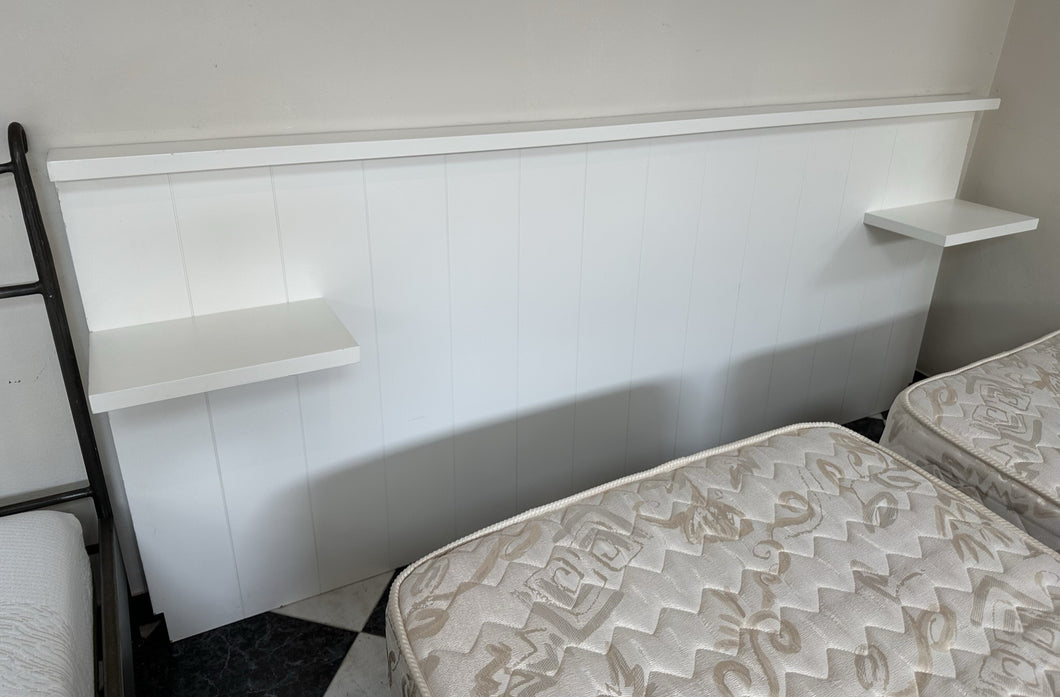 1093 - Heavy solid wooden headboard with shelves. The headboard is 230cm wide and 110cm high. The space between the shelves is 150cm, so would fit a king size 150cm wide bed.