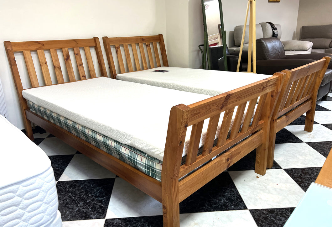 1111 - Two wooden single beds with mattress and memory foam topper (90cm x 190cm)