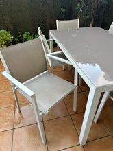 Load image into Gallery viewer, 1019 - Aluminum outdoor table (152cm x 90cm) + 6 chairs. It is in good condition, the "scratches" on the top are reflection.
