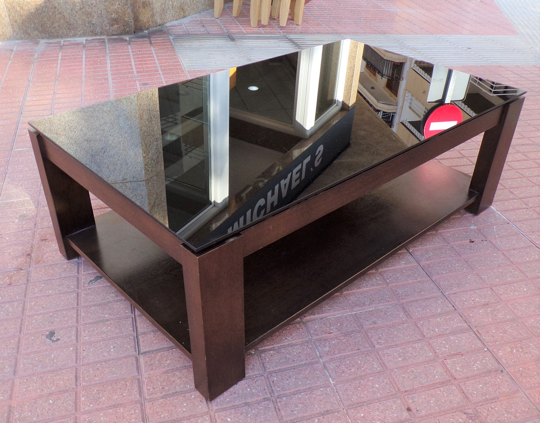 1133 - Black glass and brown wooden high quality heavy rectangular coffee table. (120cm x 70cm, 40cm high)